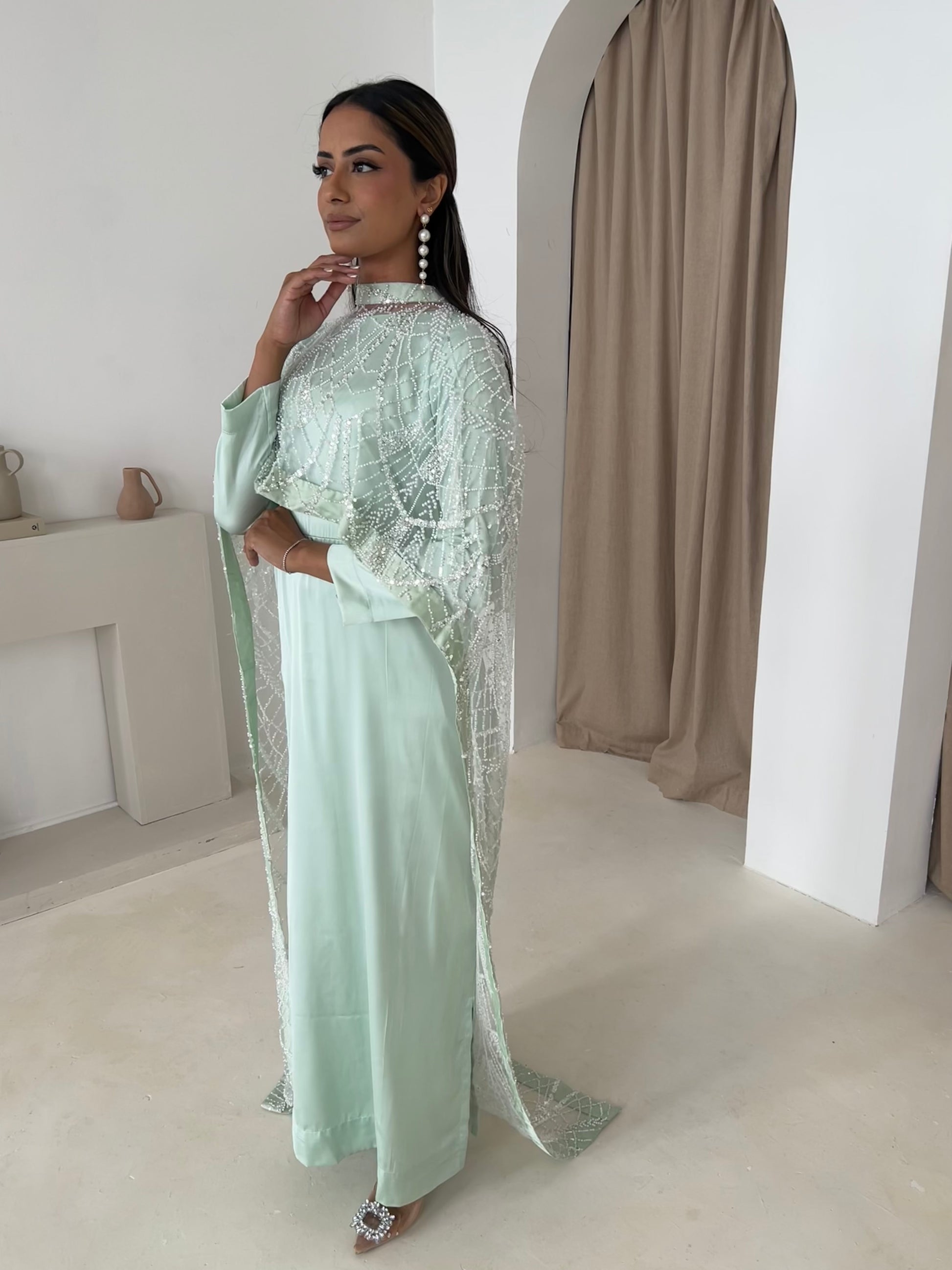 Mint cape dress with beaded cutdana on net, close-up of embellishment