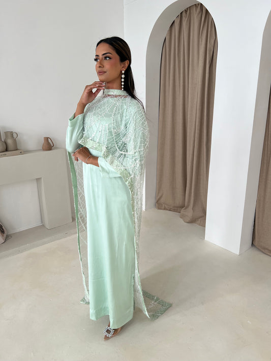 Fabric texture of mint net cape with beadwork – detail shot