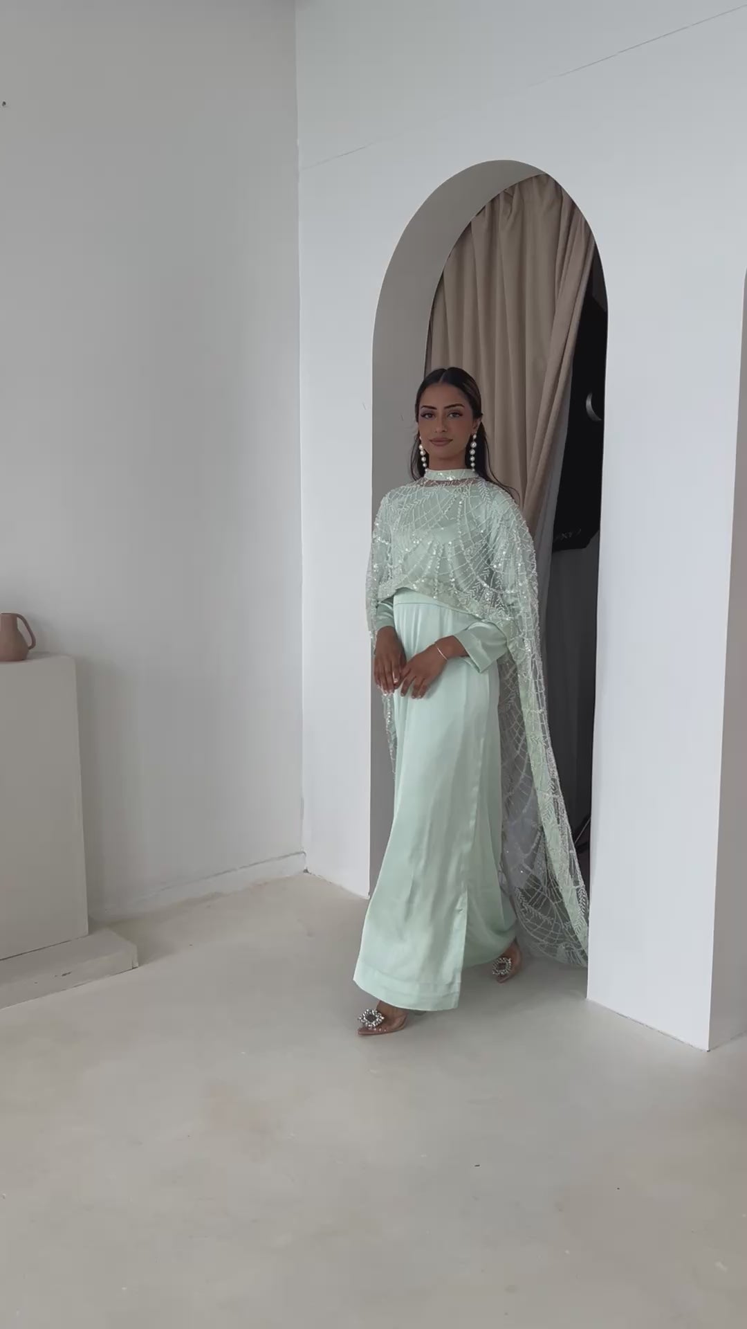 Model 5’6 wearing Dina Mint cape with modest satin slip
