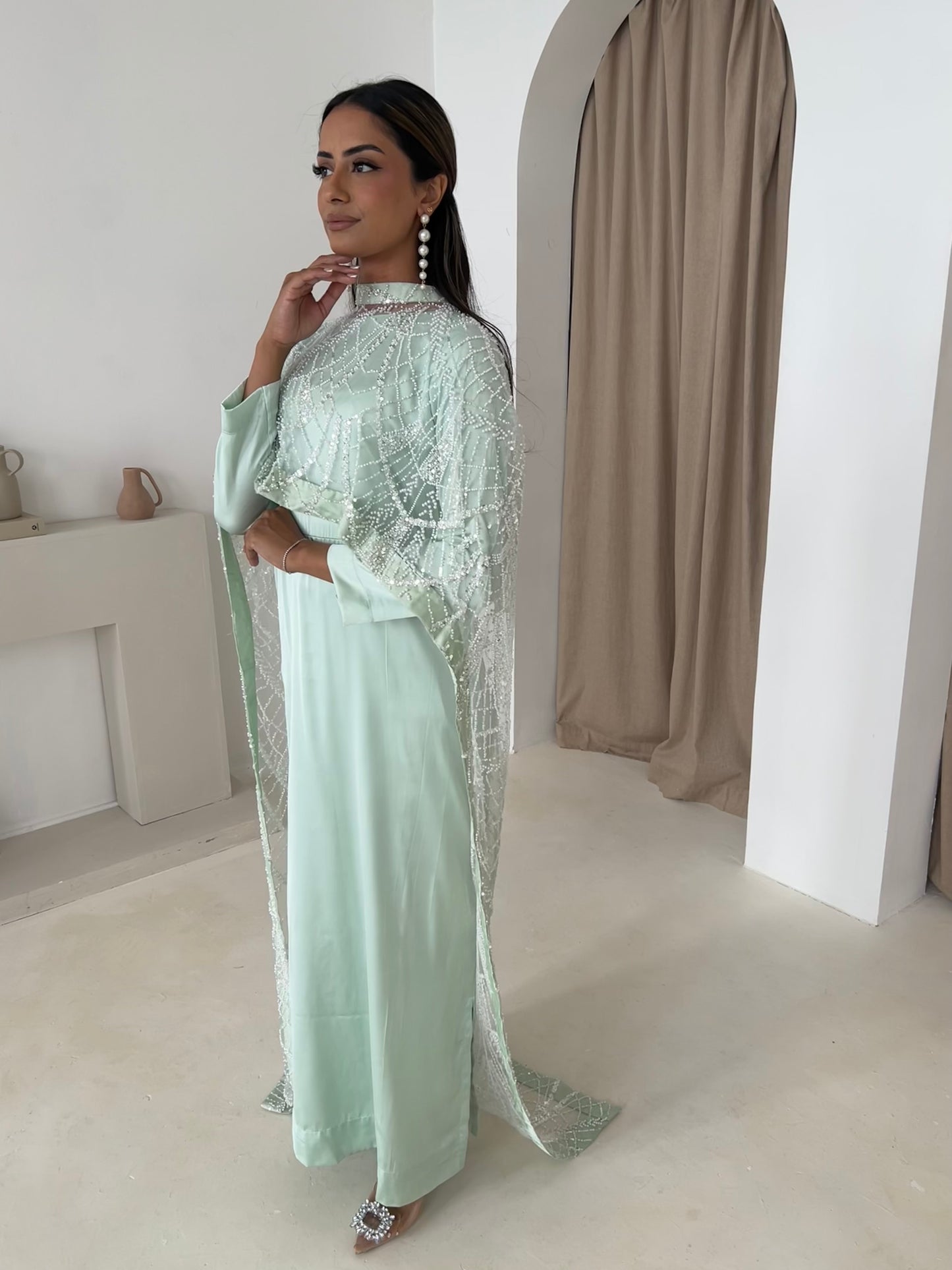 Mint cape dress with beaded cutdana on net, close-up of embellishment