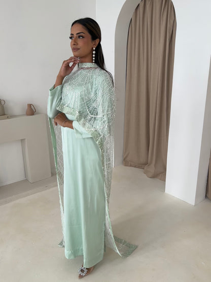 Mint cape dress with beaded cutdana on net, close-up of embellishment