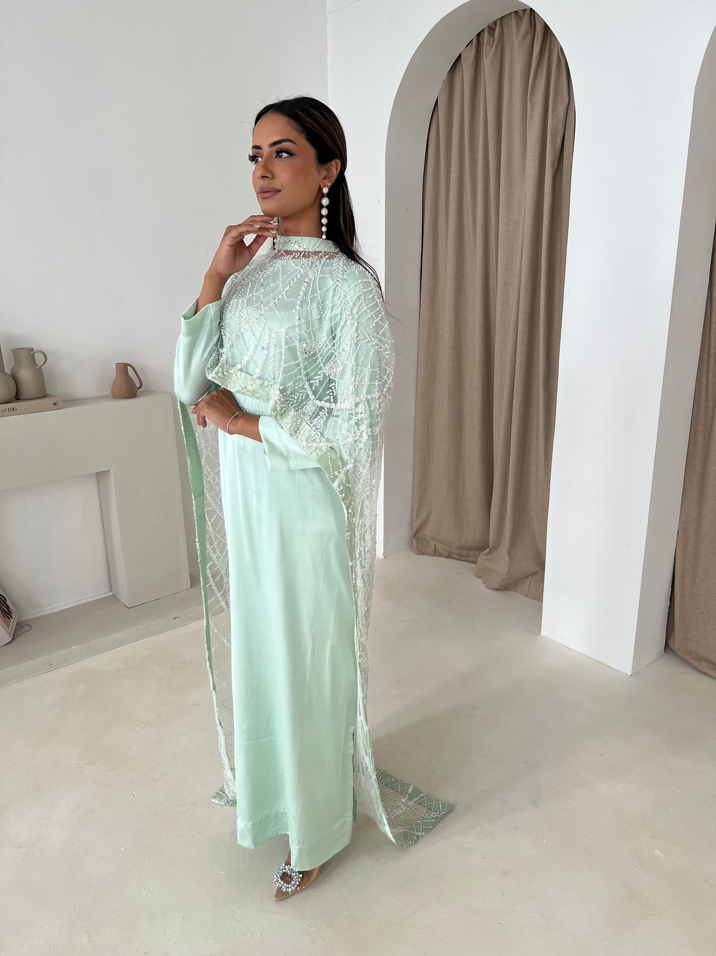 Fabric texture of mint net cape with beadwork – detail shot